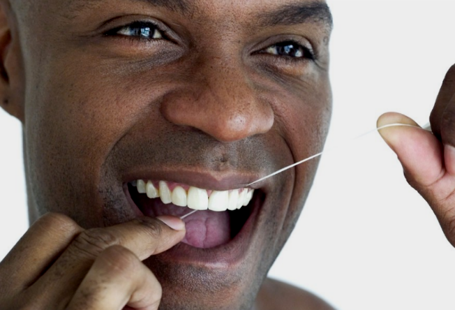 121012-health-rewind-teeth-floss-flossing-dental-dentist